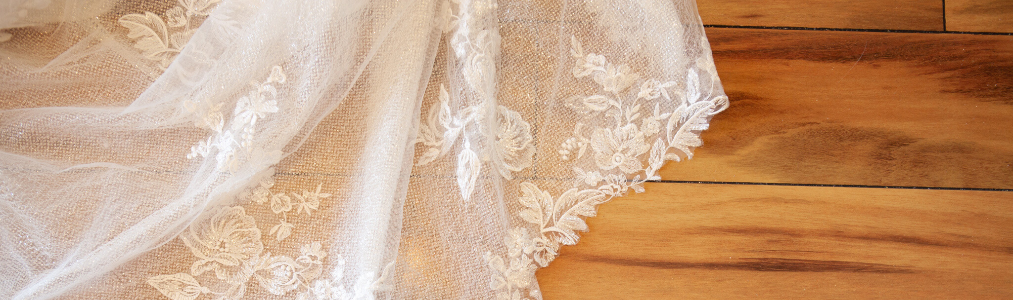 Bridal Dress on Wooden Floor. Desktop Image